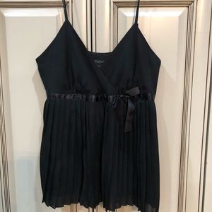 Black silk pleated cami with satin bow accent.
